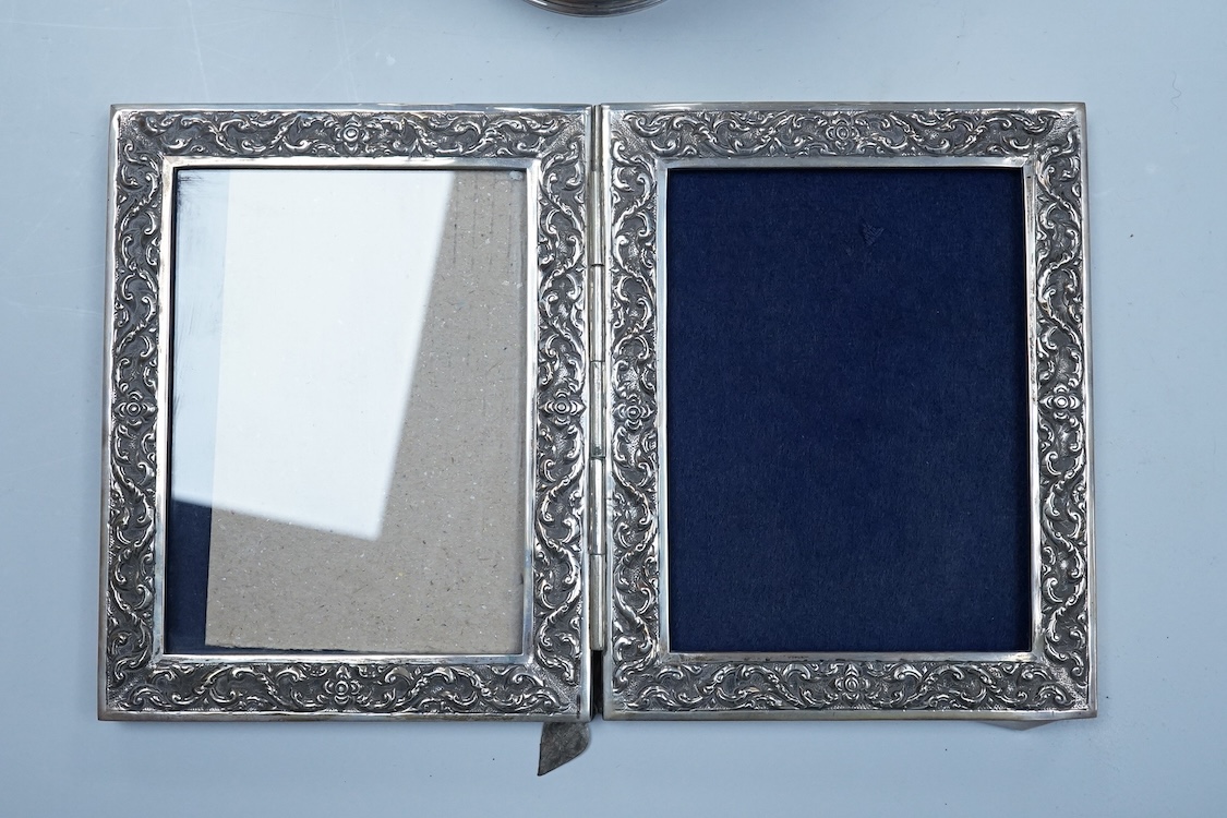An Elizabeth II silver baluster christening mug, Wakely & Wheeler, London, 1965, with engraved inscription to the base, 10cm, together with two modern silver mounted photograph frames including a double and one other met